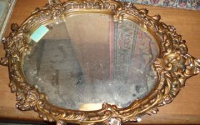 Oval Framed Mirror.