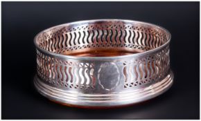 A Nice Quality Silver & Oak Round Wine Coaster with openwork sides and stepped rim. Hallmark