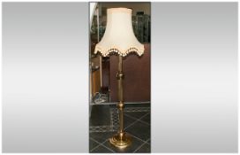 Brass Colour Standard Lamp, with a Reeded Oak Knop Stem, Terminating on a Brass Base, with Silk