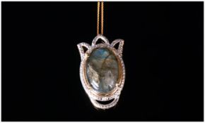 Labradorite Pendant With Chain, the labradorite cabochon, of 12.25cts, displaying a good range of