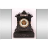 French/Paris Late 19th Century Black Marble Shaped Mantle Clock with 8 day striking movement,