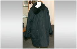 Ladies Three Quarter Length Black Coat with faux fur lined collar & cuffs.