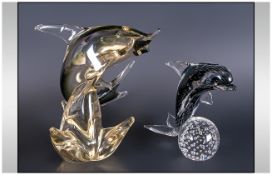 Two Murano Glass Dolphin Figures comprising dolphin on a bubbled ball base in grey hues 7 inches
