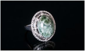 Siberian Seraphinite Ring, an oval 8ct cabochon of the unusual olive green stone with silvery