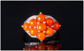 Orange Ethiopian Opal Cluster Ring, nine round cut cabochons of the unusual orange opal, which