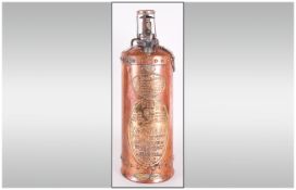An Unusual Copper and Brass Vintage Fire Extinguisher dated 1936 with unusual embossed makers plaque