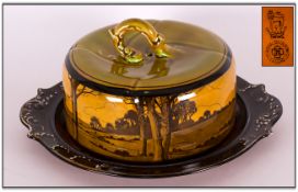 Royal Doulton Antique Treacle Glazed Cheese Dome and Stand. c.1907. A View of Windmills and Trees In