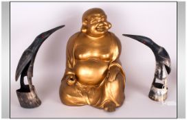 Japanese Gilt Pottery Figure of a Seated Buddha. 14 Inches High, with a Pair of Horn Carvings of