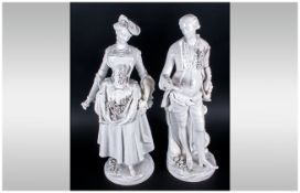 Pair Of German 19th Century Porcelain Figures of an elegant lady holding flowers in her hands,
