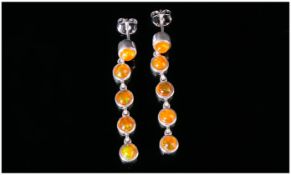 Orange Ethiopian Opal Long Drop Earrings, each earring comprising five round cut cabochons, bezel