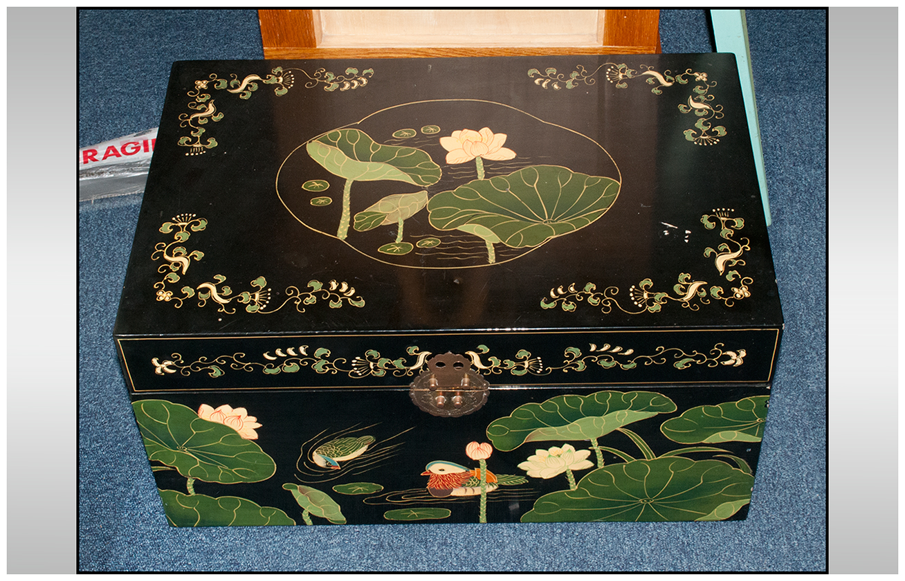 A Chinese Lacquered Bedding Box painted with Lotus decorations to the top and sides, with Mandarin