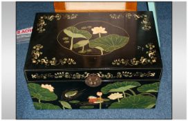 A Chinese Lacquered Bedding Box painted with Lotus decorations to the top and sides, with Mandarin