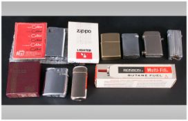A Small Collection of Vintage Petrol Lighters ( 7 ) In Total. Includes 1/  Zippo - Brass XV Petrol