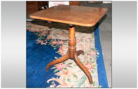 A Late Georgian Mahogany Rectangular Topped Side Table supported by a turned tier dropped column