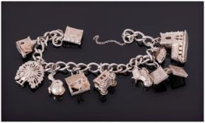 Silver Charm Bracelet Loaded With 10 Charms.