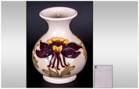 Moorcroft Globual Shaped Vase ' Columbine ' Design on Cream Ground. c.1980's. Stands 5.25 Inches