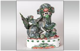 Chinese Shi Shi Temple Dog and Pups Decorated In Famille Verte Coloured Glazes, Mounted on a Oval