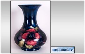 William Moorcroft Signed Vase 'Pansy' Design On Blue Ground, Circa 1920's, Overpainting to neck