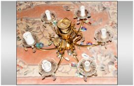 A Six Branch Brass Chandelier with glass sconces with crystal drops, 16 inches diameter by 16 inches