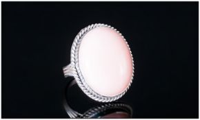 Pink Opal Solitaire Ring, an oval cut cabochon of a generous 28cts of the ethereal pink oval,