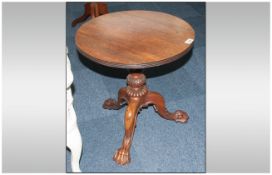 A Small Round Rosewood Regency Style Low Table with a reeded edge to the top and shaped carved