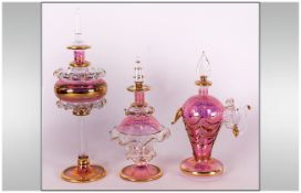 A Vintage Trio Of Pink/Clear/Gold Coloured Glass Perfume Bottles, tallest 7'' in height. All bottles