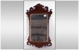 Reproduction Mahogany Chippendale Style Wall Mirror with a fret worked frame & inner gilt border.
