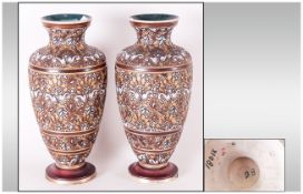 Pair of Doulton Stoneware Vases, textured stylised floral form in golds and browns. Odd chips to