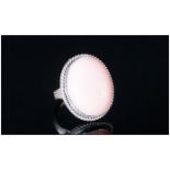 Pink Opal Solitaire Ring, an oval cut cabochon of a generous 28cts of the ethereal pink oval,