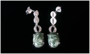 Siberian Seraphinite Long Drop Earrings, each earring comprising an oval cut cabochon of seraphinite