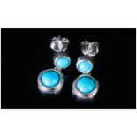 Sleeping Beauty Turquoise Drop Earrings, each earring comprising two round cut turquoise from the