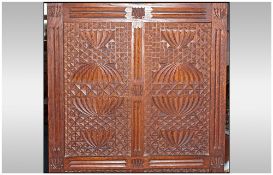 A Rare Aesthetic Movement Highly Carved Cabinet Cupboard In Oak. The top has three leaded top