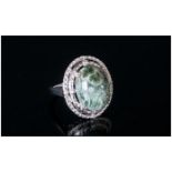 Siberian Seraphinite Ring, an oval 8ct cabochon of the unusual olive green stone with silvery