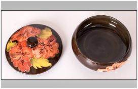 Moorcroft Lidded Powder Bowl ' Coral Hibiscus ' Pattern, on Chocolate Coloured Ground. 3 Inches