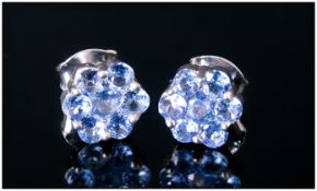 Pair of Tanzanite Stud Earrings, each comprising a cluster of seven round cut tanzanites, pressure