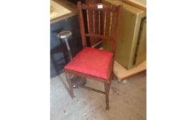 Wooden Chair with Red Cushion.