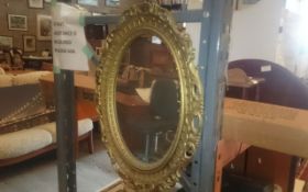 Oval Framed Mirror.