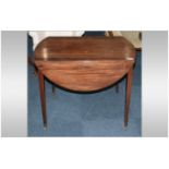 A Georgian Mahogany Pembroke Table with an oval shaped top, Flat sided with one drawer, on square