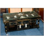 Chinese Black Lacquered Low Table with a glass top, onlaid with carved figures of traditional ladies