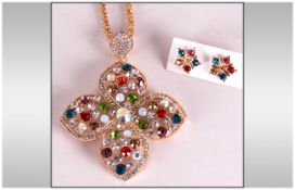 Large Austrian Multicolour Crystal Quatrefoil Pendant on a long fancy chain, plus pair of similar,