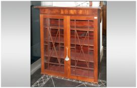 Early Victorian Mahogany Astral Glazed Double Door Cabinet with three shelves to the interior with a