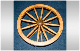 Cog Wheel Coffee Table with a glazed top on turned spindle legs, 36 inches in diameter.