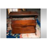 Mahogany Newspaper Stand with central apertures for magazines with shaped Lyre sides. 23'' in width,