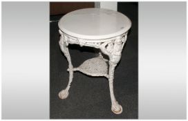 Britannia Cast Iron Base Pub Table with a wooden top. Painted white. 24'' in diameter, 29'' in