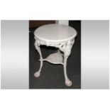 Britannia Cast Iron Base Pub Table with a wooden top. Painted white. 24'' in diameter, 29'' in