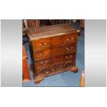 Reproduction Mahogany Small Size Chest of Drawers with a carved block front, Rhode Island