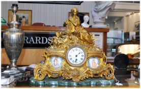 French Gilt Brass Figural Mantle Clock. Central Dial Between two Sevres Style Plaques. Raised on a