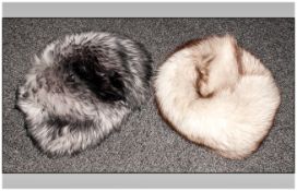 Blue Fox Fur Hat together with one other. Both in a blue & white hat box