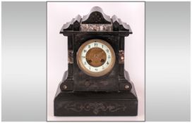 French/Paris Late 19th Century Black Marble Shaped Mantle Clock with 8 day striking movement,