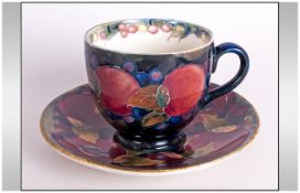 William Moorcroft Signed Cup and Saucer. c.1920's. Pomegranate and Leaves Pattern. Saucer 4.5 Inches